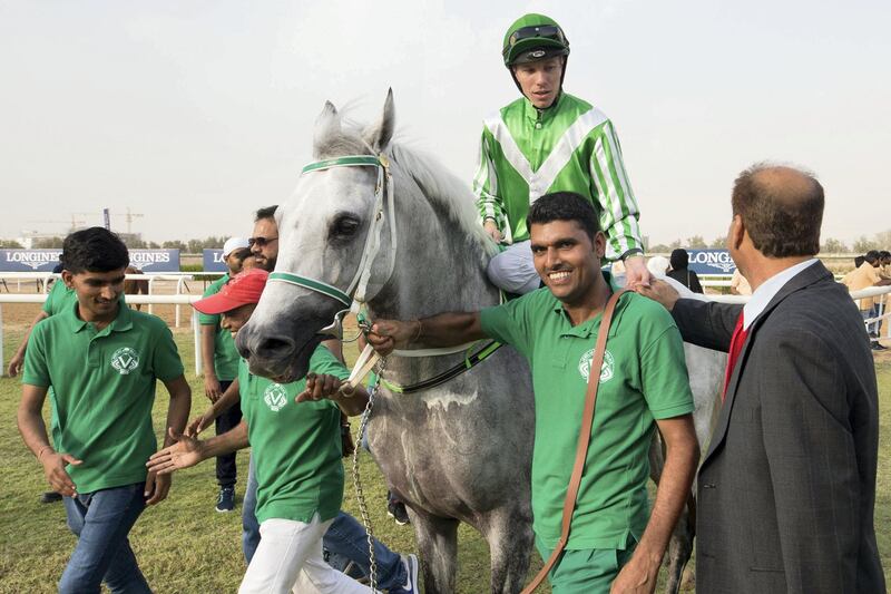 09.11.19. Sharjah. Race 4  Qanoon - trainer Irfan Ellahi cogratulates  jockey Szczepan Mazur  - Erika Rasmussen