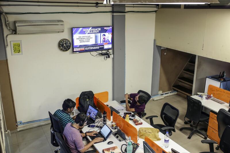 Employees work at the Boom Live office in Mumbai, India, on Friday, March 28, 2019. Boom is one of seven tiny fact-checking firms at the heart of Facebook Inc.'s efforts to rebuild some of its credibility during India's elections. Photographer: Dhiraj Singh/Bloomberg