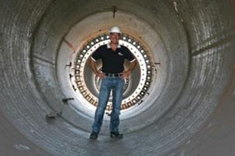 David Chambers of Trident Support stands inside a section of the flagpole built for Azerbaijan.