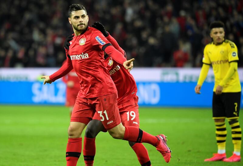 Leverkusen's German forward Kevin Volland celebrates after scoring a goal during the German first division Bundesliga football match Bayer 04 Leverkusen vs BVB Borussia Dortmund in Leverkusen, western Germany on February 8, 2020. (Photo by INA FASSBENDER / AFP) / RESTRICTIONS: DFL REGULATIONS PROHIBIT ANY USE OF PHOTOGRAPHS AS IMAGE SEQUENCES AND/OR QUASI-VIDEO