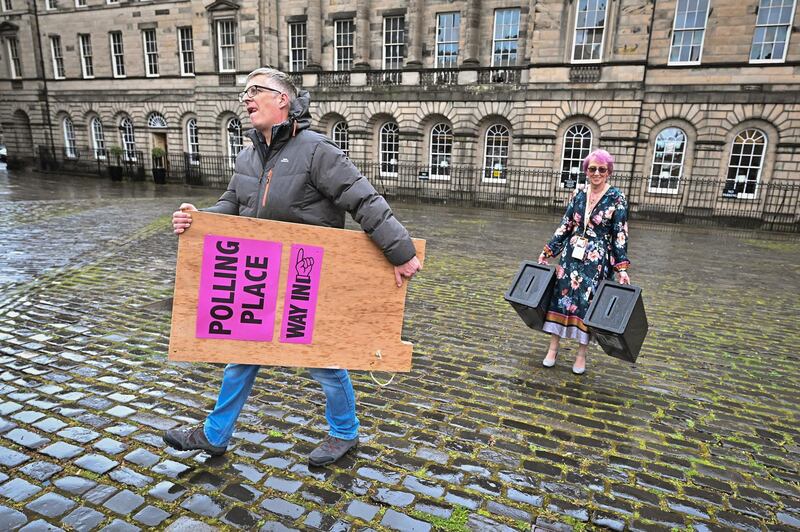 Staff at Edinburgh City Council move ballot boxes as they're taken for distribution to polling stations in Edinburgh. Getty Images