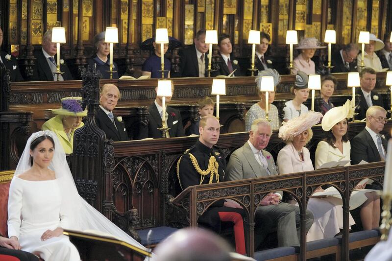 WINDSOR, UNITED KINGDOM - MAY 19:  Meghan Markle in St George's Chapel, Windsor Castle for her wedding to Prince Harry watched by (middle row from left) Queen Elizabeth II, Duke of Edinburgh, Earl of Wessex, Viscount Severn, Countess of Wessex, Lady Louise Mountbatten-Windsor, Princess Royal, Sir Tim Laurence, (front row from left) Duke of Cambridge, Prince of Wales, Duchess of Cornwall Duchess of Cambridge, Duke of York during her wedding in St George's Chapel at Windsor Castle on May 19, 2018 in Windsor, England. (Photo by Jonathan Brady - WPA Pool/Getty Images)