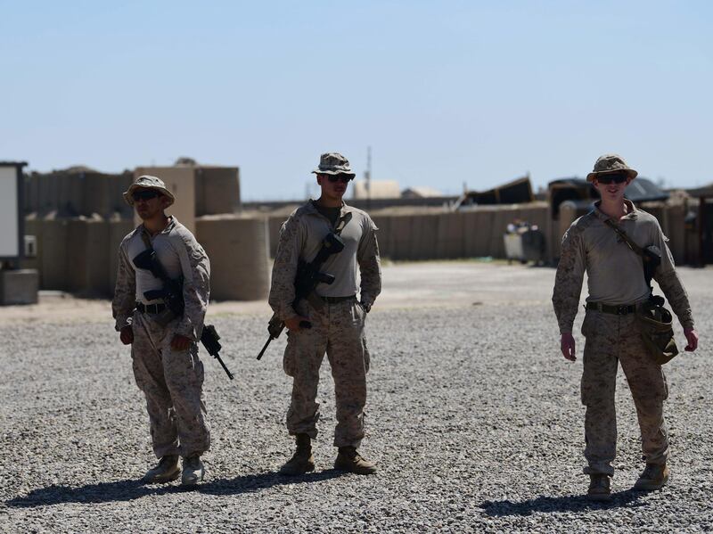 epa08343385 US soldiers stand guard during the handover ceremony of the Al-Taqaddum Airbase (Habbaniyah), western Baghdad, Iraq on 04 April 2020. The US-led Coalition announced their official withdrawal from the Al-Taqaddum Airbase (Habbaniyah) in Iraq's Anbar Governorate, and transferring equipment and buildings worth approximately 3.5 million US dollars to the Iraqi government. The airbase is located in Habbaniyah, approximately 74 kilometers west of Baghdad.  EPA/MURTAJA LATEEF