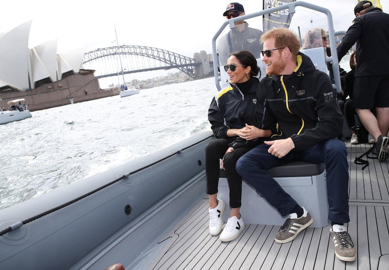 The Duke and Duchess of Sussex watch competitors taking part in a sailing event at the 2018 Invictus Games in Sydney harbour.