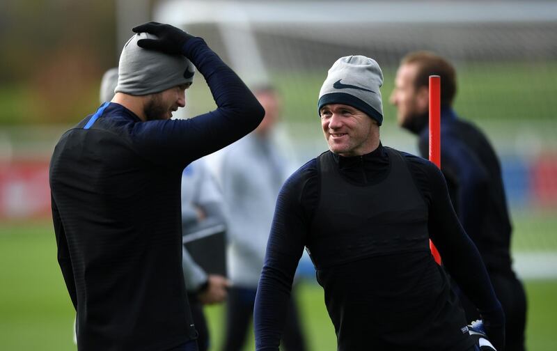 BURTON-UPON-TRENT, ENGLAND - NOVEMBER 14:  Wayne Rooney of England talks to Eric Dier of England during a training session at St Georges Park on November 14, 2018 in Burton-upon-Trent, England. (Photo by Gareth Copley/Getty Images)