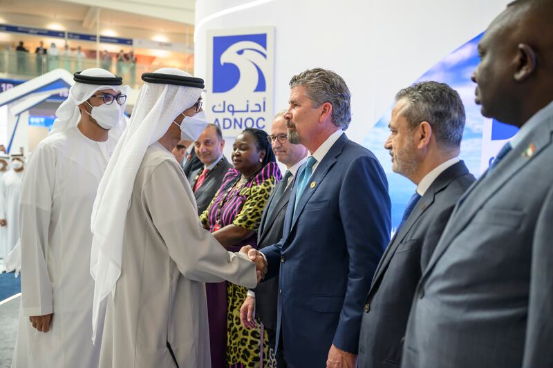 President Sheikh Mohamed greets an energy industry executive at the 2022 Abu Dhabi International Petroleum Exhibition and Conference being held at Adnec. Hamad Al Kaabi / UAE Presidential Court 

