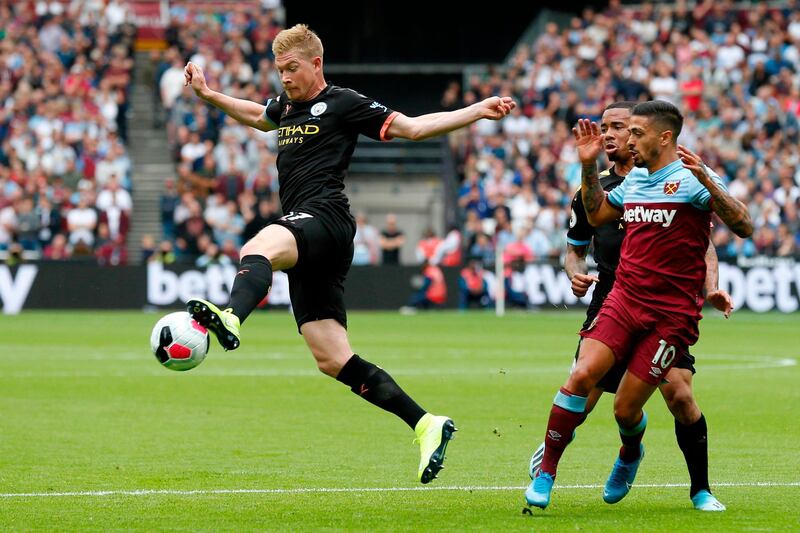 Kevin De Bruyne stretches for the ball for City. AFP