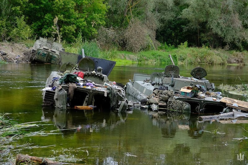 Half-submerged Russian tanks amid the Ukrainian counter-offensive in Kharkiv.  AFP