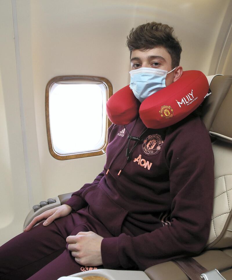 MANCHESTER, ENGLAND - FEBRUARY 17: (EXCLUSIVE COVERAGE)  Daniel James of Manchester United poses on the plane ahead of their flight to Turin at Manchester Airport on February 17, 2021 in Manchester, England. (Photo by Matthew Peters/Manchester United via Getty Images)