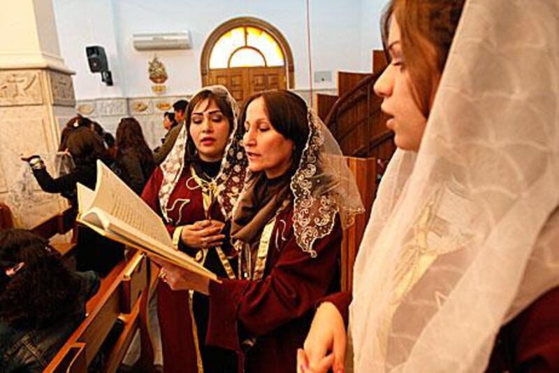 Iraqi Christians attend a mass on Christmas at the Virgin Mary church in Baghdad.