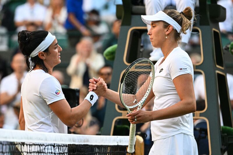 Tunisia's Ons Jabeur and Belgium's Elise Mertens shake hands at the end of their match. AFP