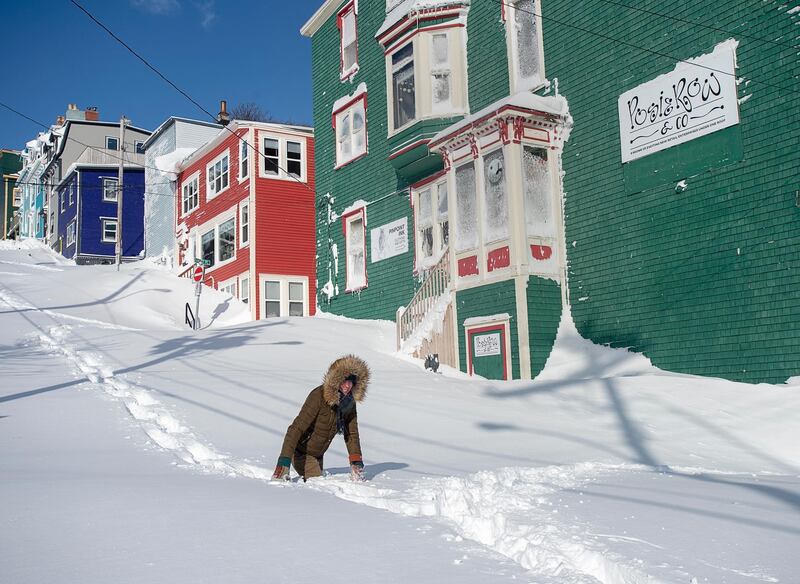 A residents makes their way through the snow in St. John's, Newfoundland.  AP