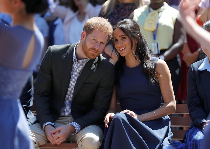 Prince Harry and Meghan watch a performance during their visit to Macarthur Girls High School. Reuters