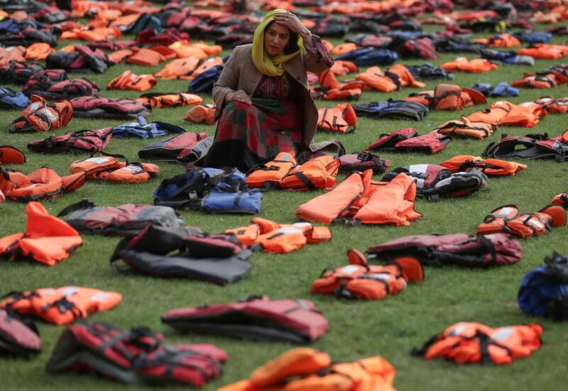 2,500 lifejackets, worn by refugees during crossings from Turkey to the Greek island of Chios, are displayed on Parliament Square, opposite the Houses of Parliament, in central London, during a photcall to highlight the number of refugees that have died trying to reach Europe since 2015. A summit to address the biggest refugee crisis since the Second World War opens at the United Nations on Monday, overshadowed by the ongoing war in Syria and faltering US-Russian efforts to halt the fighting. World leaders will adopt a political declaration at the first-ever summit on refugees and migrants that human rights groups have already dismissed as falling short of the needed international response. Daniel Leal-Olivas / AFP