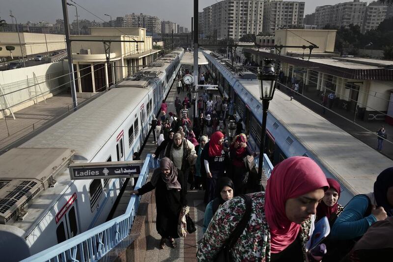Above, commuters exit a metro station in Cairo. Egypt’s metro construction is moving at glacial pace. Nariman El Mofty / AP Photo