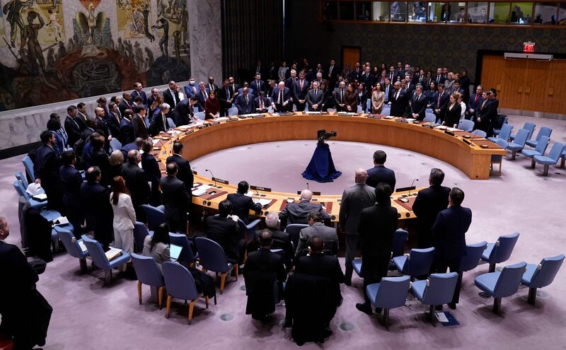 Representatives stand for a moment of silence during the United Nations Security Council meeting on the maintenance of peace and security of Ukraine at the UN headquarters in New York. AFP