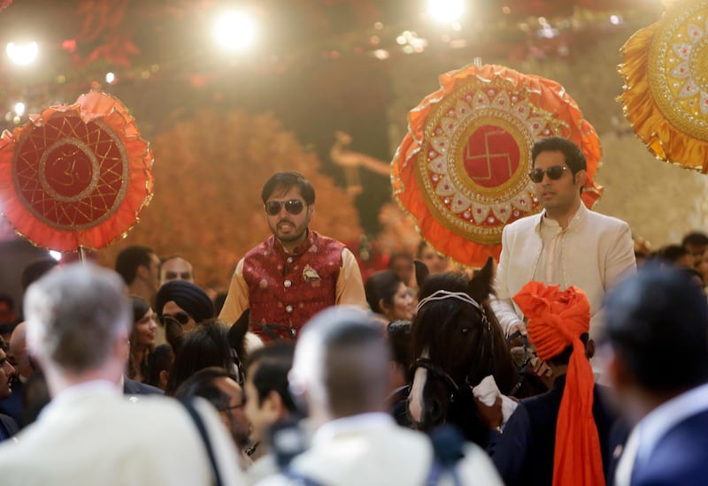 Reliance Industries Chairman Mukesh Ambani's sons Anant, left, and Aakash ride on horses during the wedding of their sister Isha in Mumbai, India, Wednesday, Dec. 12, 2018. In a season of big Indian weddings, the Wednesday marriage of the scions of two billionaire families might be the biggest of them all. Isha is the Ivy League-educated daughter of industrialist Mukesh Ambani, thought to be India's richest man. The groom, Anand Piramal is the son of industrialist Ajay Piramal, thought to be worth $10 billion. (AP Photo/Rajanish Kakade)