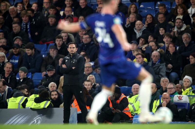 Frank Lampard looks on from the touchline during the game. AP Photo