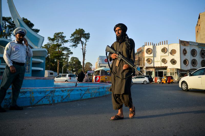 A Taliban fighter patrols a street in Herat. AFP