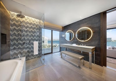 Stylish bathrooms have large soaking tubs, his and her sinks, sliding doors and balcony access. 