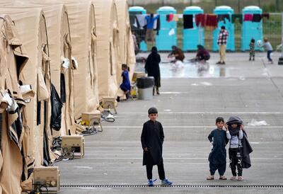 Afghans housed in tents at Ramstein US airbase in Germany. Many thousands more are trying to escape with hundreds being assisted by ex-special forces troops. AP
