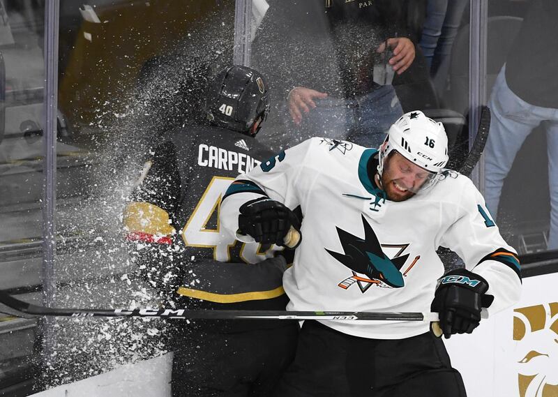 San Jose Sharks center Eric Fehr checks Vegas Golden Knights center Ryan Carpenter into the glass during the third period of game five of the second round of the 2018 Stanley Cup Playoffs at T-Mobile Arena, Las Vegas. Stephen R. Sylvanie / Reuters