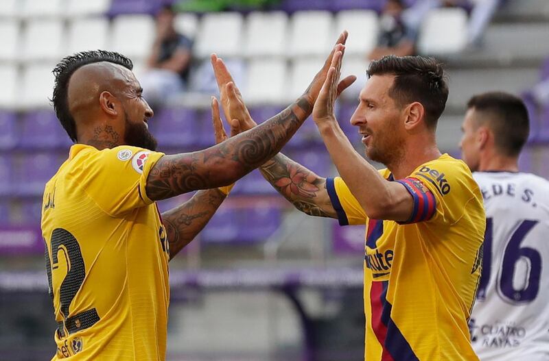 Barcelona's Arturo Vidal celebrates with his teammate Lionel Messi. AP