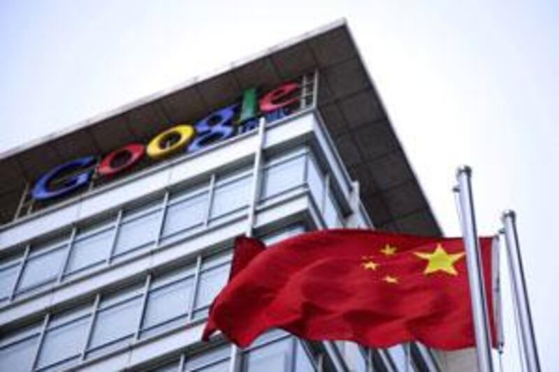 The Chinese flag is seen near the Google sign at the Google china headquarters in Beijing, China.