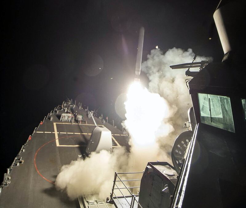An image provided by the US navy showing the USS Ross firing a Tomahawk land attack missile on April 7, 2017, from the Mediterranean Sea, striking the Shayrat airbase near Homs, Syria. Mass Communication Specialist 3rd Class Robert S Price/US navy via AP