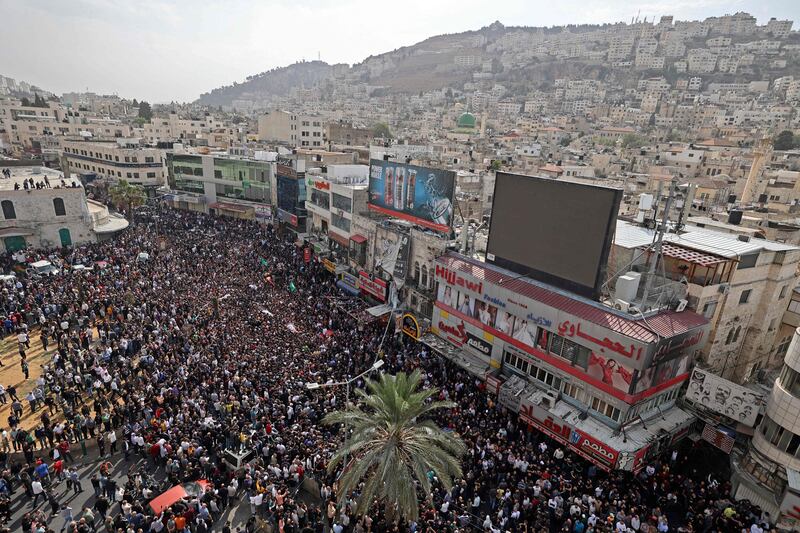 Mourners attend the funeral of Palestinians killed in an overnight Israeli raid in the occupied West Bank city of Nablus. AFP