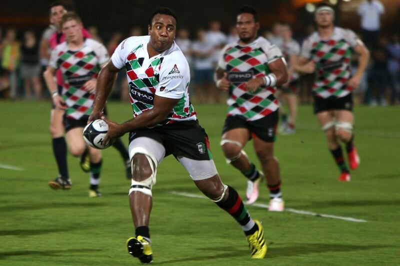 Willy Umu of the Abu Dhabi Harlequins offloads against Kandy during their West Asia Champions League match at Zayed Sports City in Abu Dhabi last night. The Harlequins won 56-17. Delores Johnson / The National


