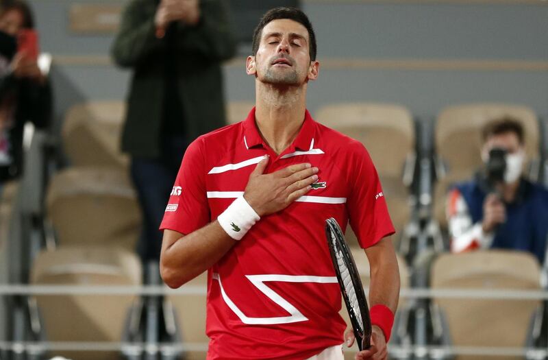 Novak Djokovic reacts after beating Stefanos Tsitsipas. EPA