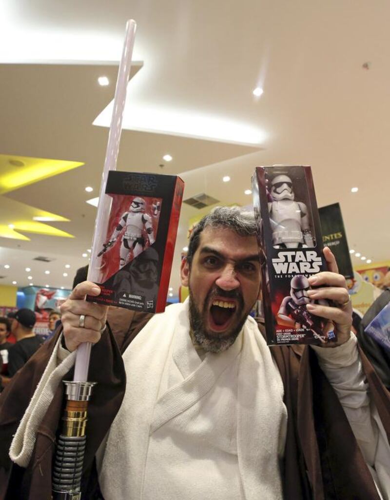 A man dressed as Obi-Wan Kenobi reacts. Paulo Whitaker / Reuters