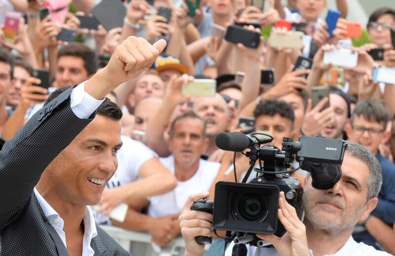 FILE PHOTO: Cristiano Ronaldo gestures as he arrives at the Juventus' medical center in Turin, Italy July 16, 2018. REUTERS/Massimo Pinca/File Photo