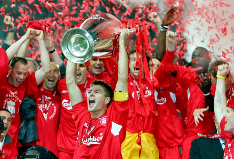 Liverpool's captain Steven Gerrard holds the trophy in front of his team mates after winning the Champions League final soccer match against AC Milan at the Ataturk Olympic stadium in Istanbul May 25, 2005. Liverpool made European soccer history by coming from 3-0 down to beat favourites AC Milan 3-2 on penalties in an astonishing Champions League final that had finished 3-3 after extra time (Photo by liewig christian/Corbis via Getty Images)