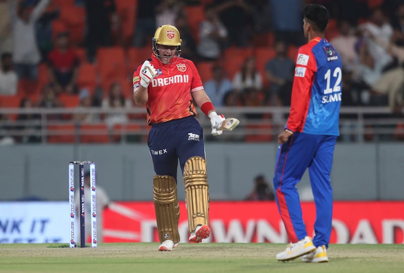 Punjab Kings' Liam Livingstone celebrates after hitting winning runs with a six to give his side a four-wicket victory against Delhi Capitals in the Indian Premier League on Saturday, March 23, 2024. The English batter made 38 runs off 21 balls. AP