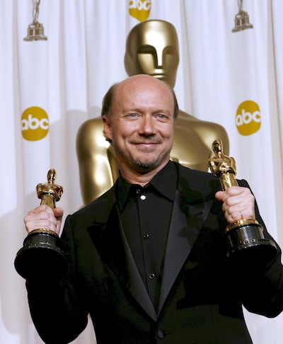 epa00660790 Director Paul Haggis holds his Oscars for 'Original Screenplay' and 'Best Picture of the Year' for the film 'Crash' at the 78th annual Academy Awards in Hollywood, California Sunday, 05 March 2006.  EPA/PAUL BUCK