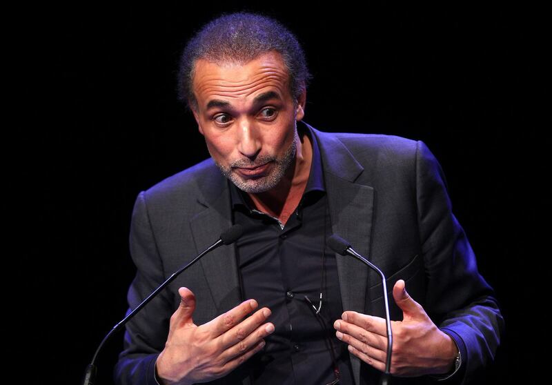 FILE - In this Feb.7 2016 file photo, Muslim scholar Tariq Ramadan delivers a speech during a French Muslim organizations meeting in Lille, northern France.  A French judge has decided to keep prominent Islamic scholar Tariq Ramadan in detention, Tuesday, Feb. 6, 2018, four days after he was charged with two alleged cases of rape by women who sought his counsel. (AP Photo/Michel Spingler, File)