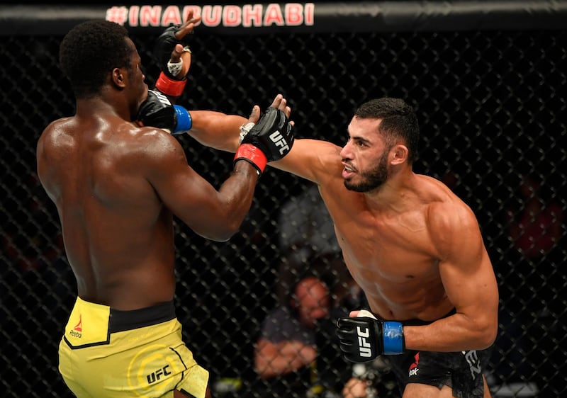Mounir Lazzez (right) of Tunisia punches Abdul Razak Alhassan of Ghana in their welterweight fight during the UFC Fight Night event inside Flash Forum on UFC Fight Island in Yas Island, Abu Dhabi.