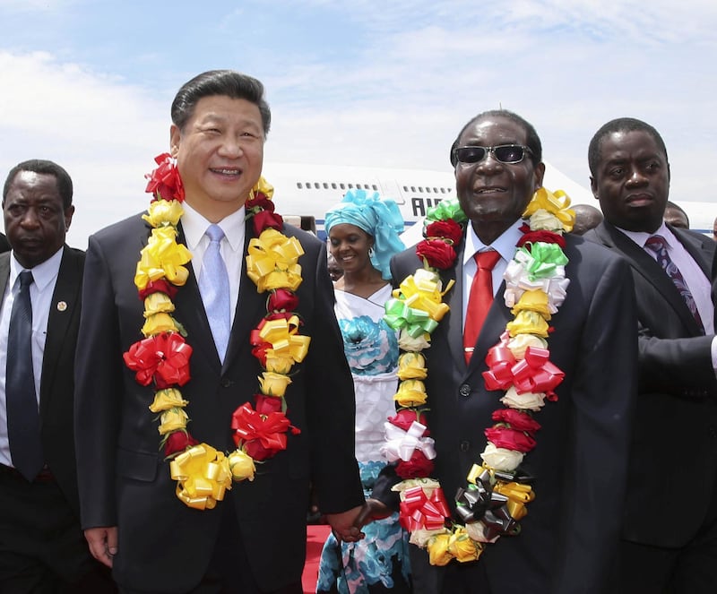 Mandatory Credit: Photo by Xinhua/Shutterstock (5460164a)
Chinese President Xi Jinping (L, front) is welcomed by Zimbabwean President Robert Mugabe in Harare, Zimbabwe
Chinese President Xi Jinping visit to Harare, Zimbabwe - 01 Dec 2015
Xi arrived here Tuesday for a state visit to Zimbabwe