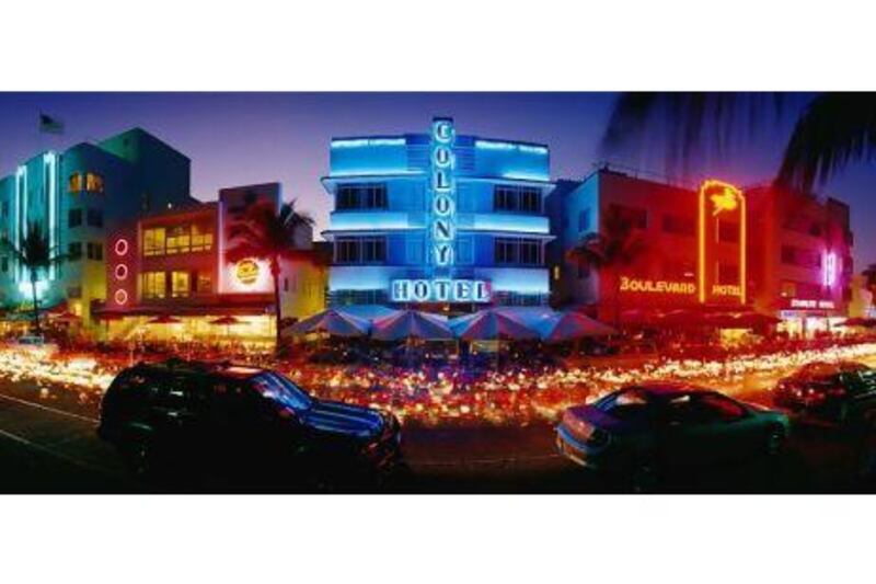 'At night, South Beach turns itself into an arresting urban film set, a procession of cool curves of Art Deco buildings illuminated by sci-fi force fields of neon lighting in red, blue and yellow.' Panoramic Images