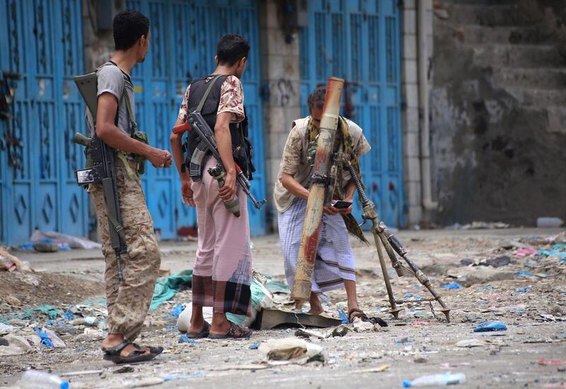 Fighters loyal to Yemen’s exiled president Abdrabu Mansur Hadi, fire a mortar shell during clashes with Shiite Houthi rebels at a military site near the country’s third-largest city of Taez on September 9, 2015. Gulf Arab monarchies have sent thousands of heavily armed troops to reinforce loyalists in Yemen in the battle against Iran-backed rebels. Al Basha/AFP Photo