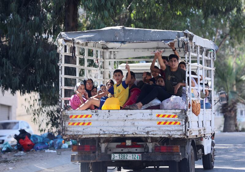 Palestinians flee their houses and travel towards the southern part of the Gaza Strip after Israel's call for more than a million civilians to leave northern Gaza ahead of a widely expected Israeli ground operation. Reuters