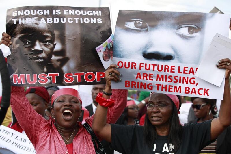 Women attend a demonstration on Monday calling on the government to rescue school girls kidnapped by Boko Haram. AP Photo