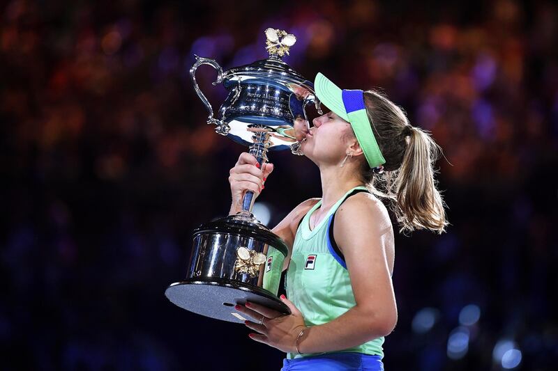 epa08184762 Sofia Kenin of the USA kisses the Daphne Ackhurst Memorial Cup trophy after winning the women's singles final against Garbine Muguruza of Spain at the Australian Open Grand Slam tennis tournament at Rod Laver Arena in Melbourne, Australia, 01 February 2020.  EPA/LUKAS COCH AUSTRALIA AND NEW ZEALAND OUT