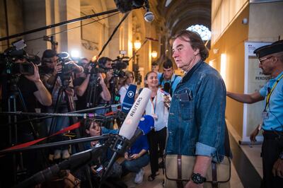 A survivor of the Bataclan attacks speaks to reporters in Paris. EPA
