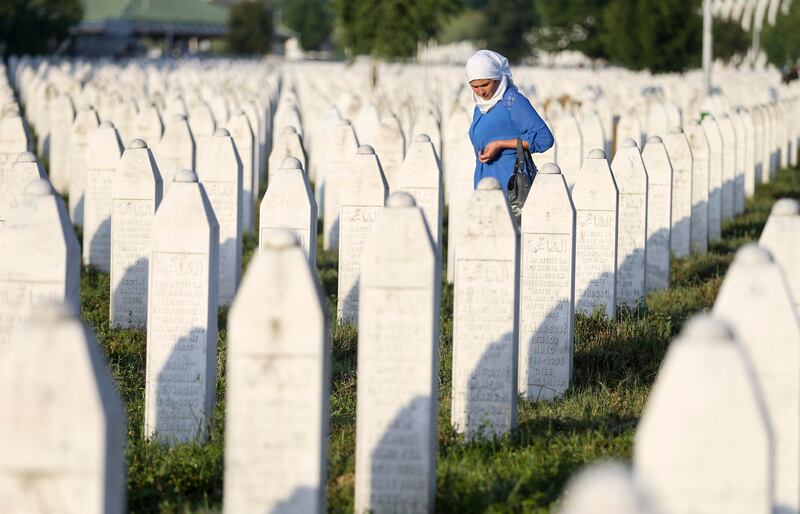 A woman walks among graves in Memorial Center Potocari, near Srebrenica, Bosnia and Herzegovina. Reuters / Dado Ruvic