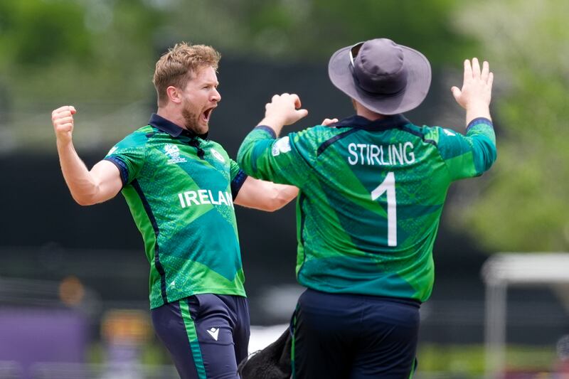 Ireland's Barry McCarthy, left, and captain Paul Stirling celebrate the wicket of Pakistan's Shadab Khan. McCarthy took three wickets for 15 runs. AP