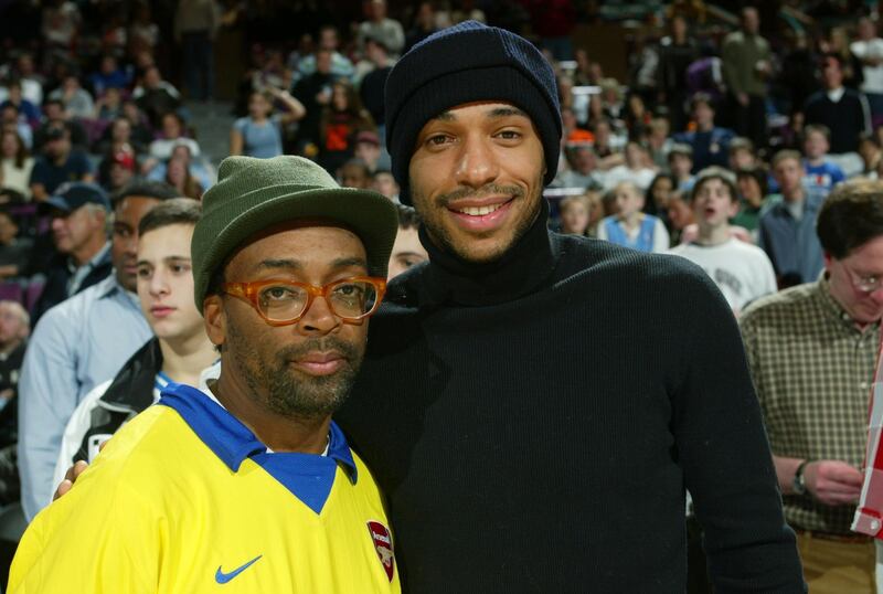 NEW YORK- JANUARY 24 :  Filmmaker Spike Lee (L) and soccer player Thierry Henry (R) of Arsenal attend the Miami Heat and New York Knicks game January 24, 2004 at Madison Square Garden in New York City. NOTE TO USER: User expressly acknowledges that, by downloading and or using this photograph, User is consenting to the terms and conditions of the Getty Images License agreement.  (Photo by Ray Amati/Getty Images) *** Local Caption *** Spike Lee;Thierry Henry
