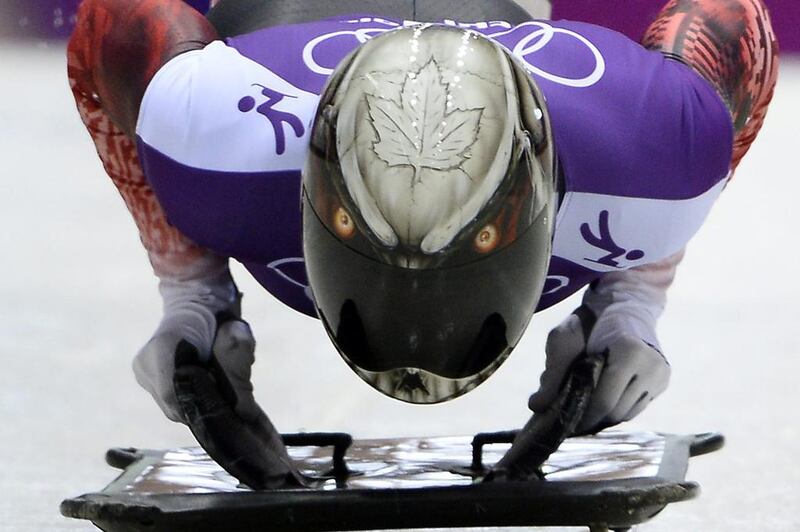 Eric Neilson of Canada wears a Maple Leaf and what appears to be a fierce-looking Canadian loon on his helmet. Lionel Bonaventure / AFP